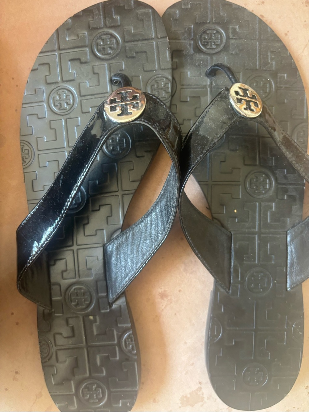Tory Burch Black Patent Flip Flop Sandals with Gold Logo Medallion
